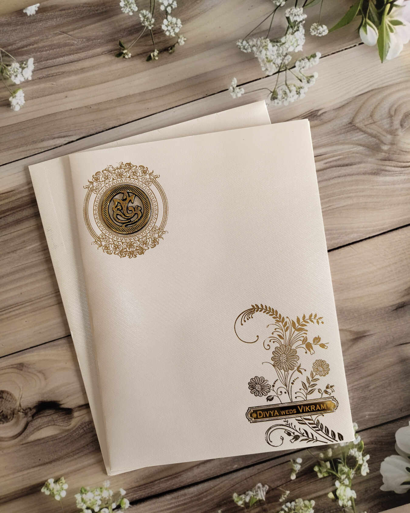 Cream Floral Gold Foiled Wedding Invitation Card with Acrylic Nameplate, Customisable Emblem & Matching Envelope