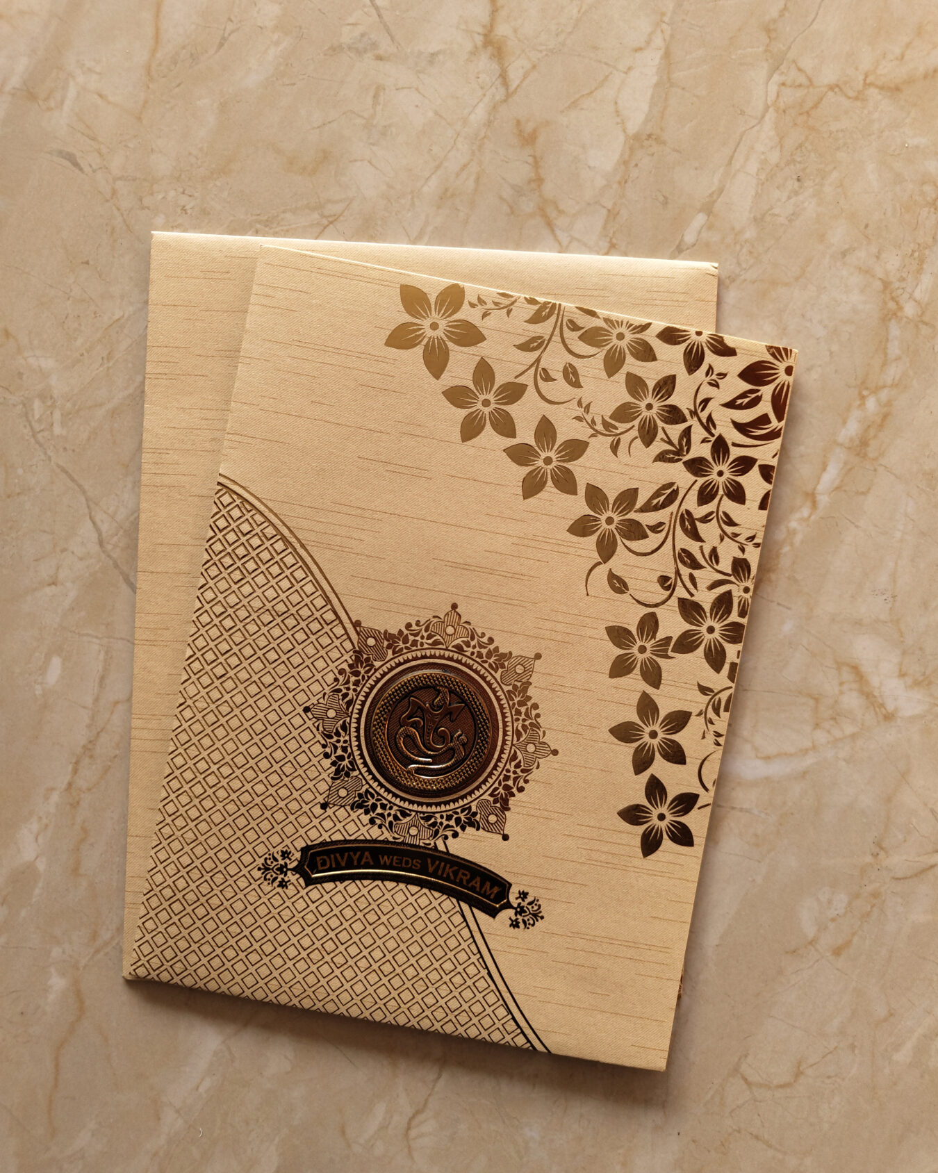 Sandal Golden Floral Wedding Invitation Card with Acrylic Nameplate, Customisable Emblem & Matching Envelope
