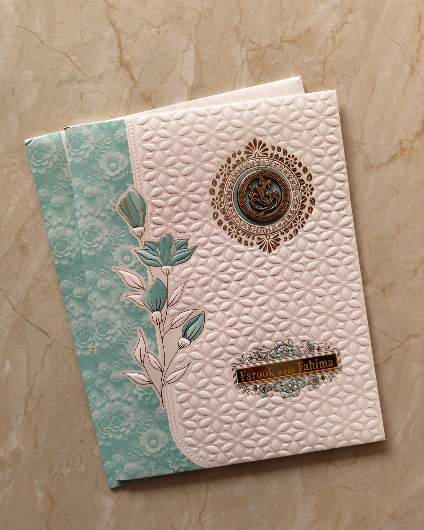 Elegant Blue & White Floral Embossed Wedding Invitation Card with Acrylic Nameplate, Customisable Emblem & Matching Envelope