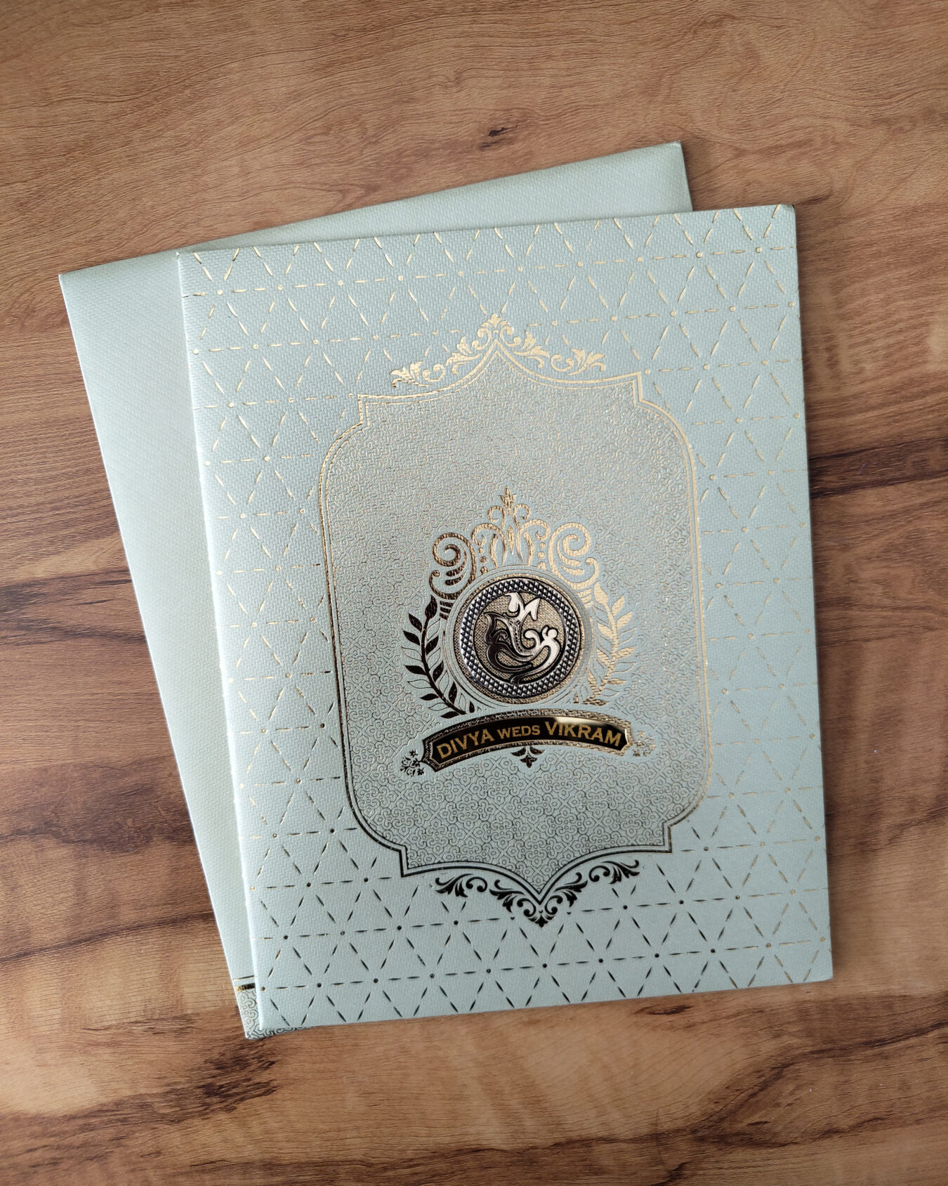 Pastel Green Booklet Wedding Invitation Card with Acrylic Nameplate & Customisable Emblem and Matching Envelope